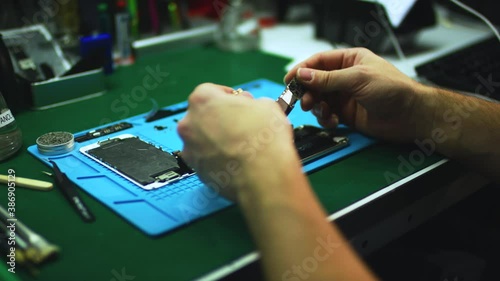 Assembling electronic components of a smartphone