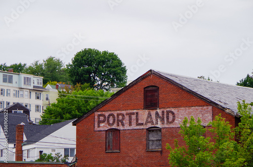 Romantic backstreet, side street or alley in historic old town of Portland, Maine with New England Victorian style architecture facades, a landmark sightseeing tourist spot in old town photo