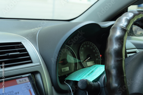 Wallpaper Mural Medical protective mask placed inside the car. Selective focus. Protection from bacteria and virus concept. Coronavirus pandemic in the world. Torontodigital.ca