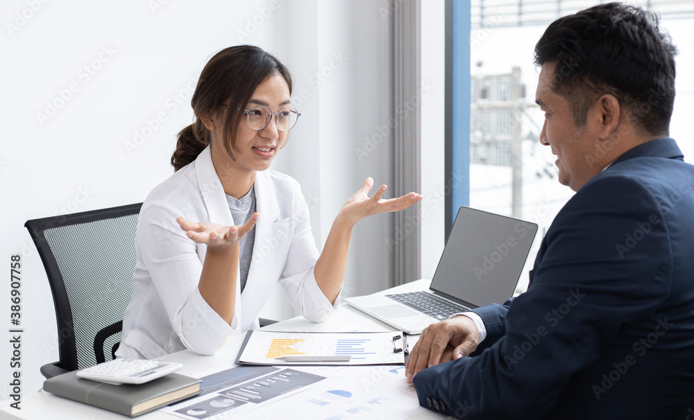 Job meeting between a business woman boss and a male finance worker. Job meeting between a business woman boss and a male finance worker.