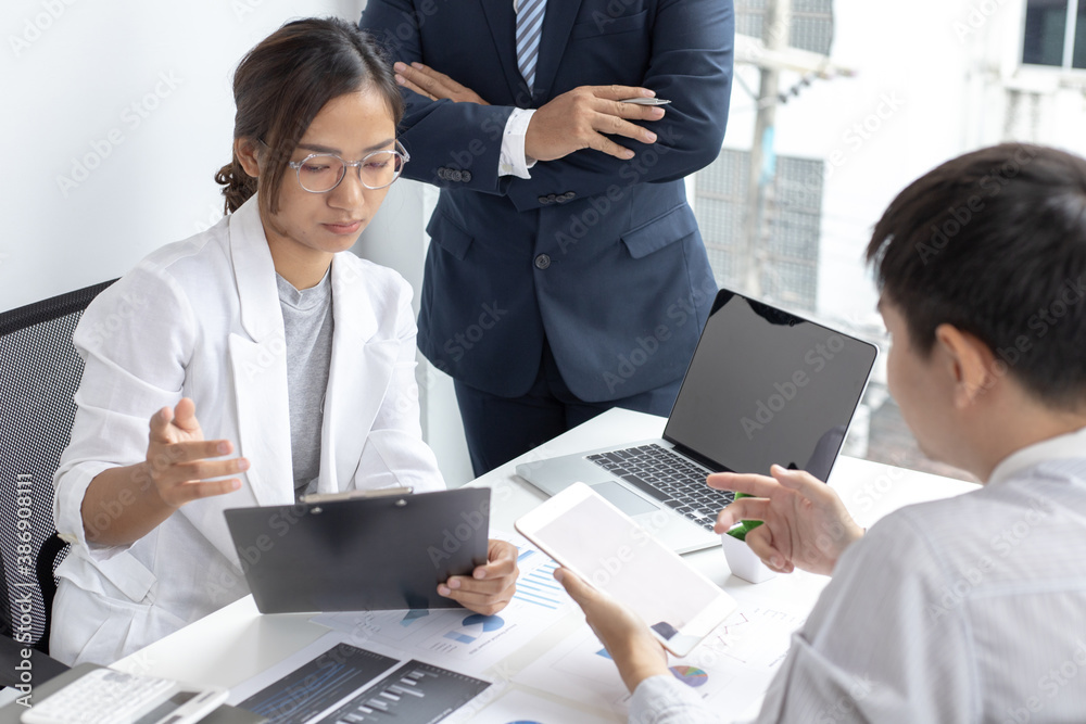 Three businessmen are brainstorming on how to manage the company's finances so that production costs can be reduced for future profit. Three businessmen are brainstorming on how to manage the company's finances so that production costs can be reduced for future profit.