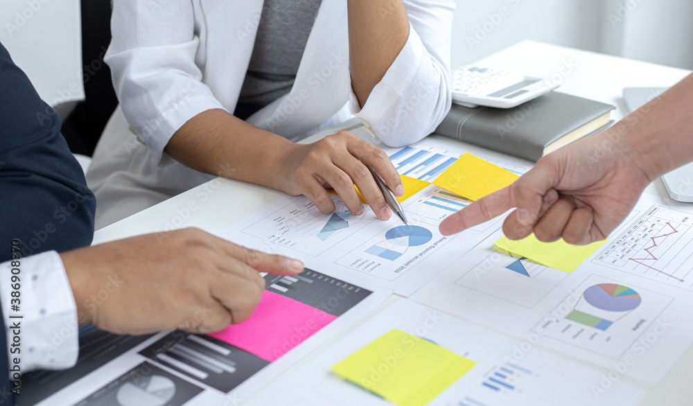 Three businessmen are brainstorming on how to manage the company's finances so that production costs can be reduced for future profit. Three businessmen are brainstorming on how to manage the company's finances so that production costs can be reduced for future profit.