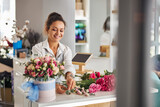 Joyous woman enjoying being a qualified florist