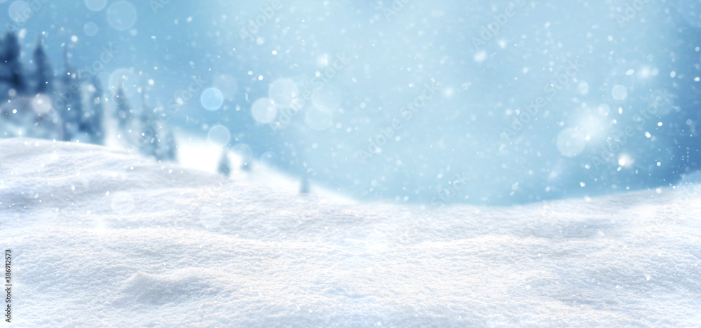 Christmas snow background with snow drifts and snow-covered blur forest Christmas snow background with snow drifts and snow-covered blur forest