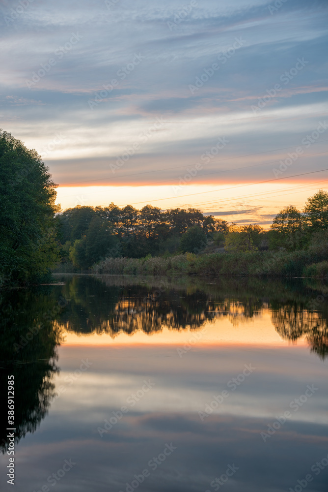 Obraz premium sunset over the river
