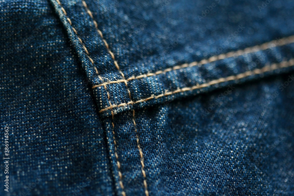 Fototapeta premium Jeans denim texture close up , focus only one point , soft blured background wallpaper