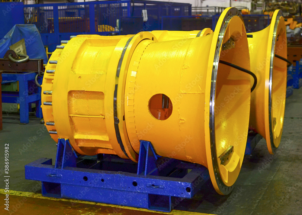 Motor-wheel gear for minin truck in workshop of automative plant. Planetary gearboxes and electric drives for quarry machinery and earthmoving equipment. Manufacture hybrid-diesel engines, reducer Motor-wheel gear for minin truck in workshop of automative plant. Planetary gearboxes and electric drives for quarry machinery and earthmoving equipment. Manufacture hybrid-diesel engines, reducer