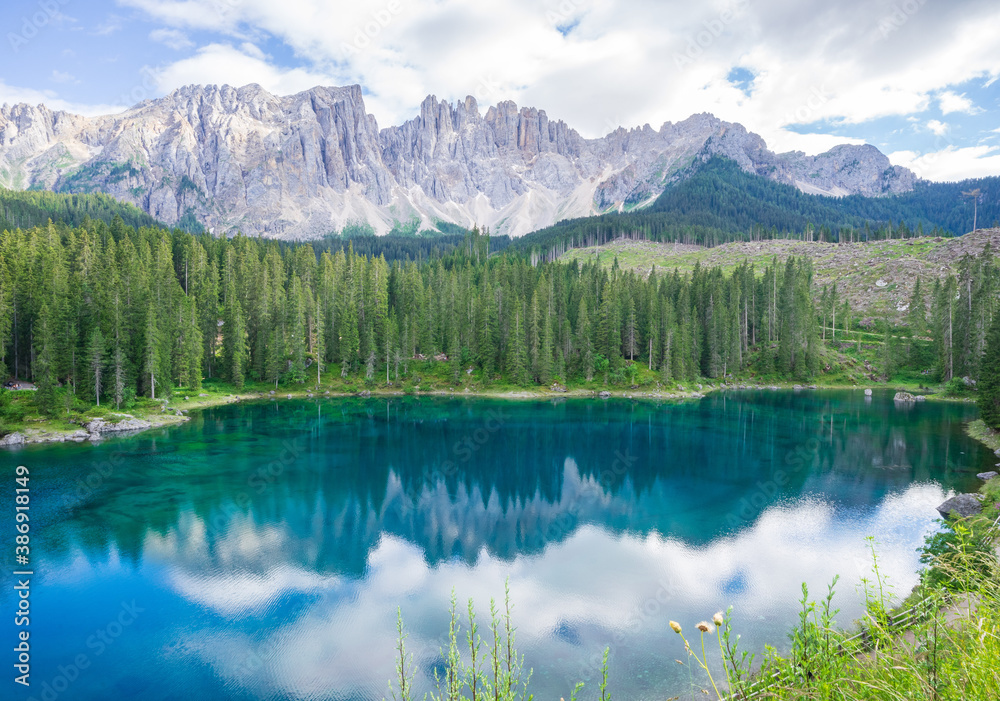 Amazing and turquoise Carezza lake, Dolomites Alps. South Tyrol. Italy