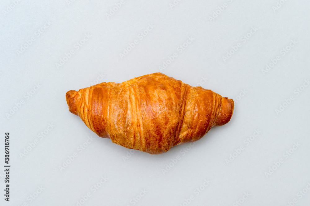 Fresh tasty croissant on grey background. French pastry Fresh tasty croissant on grey background. French pastry