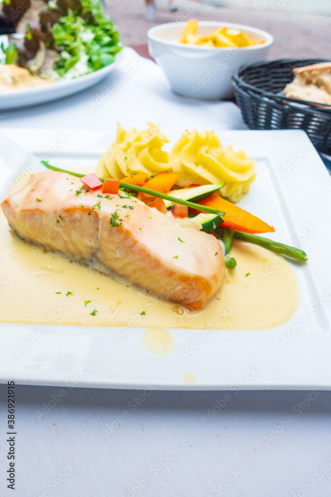 french cuisine dish with tomato and salmon
