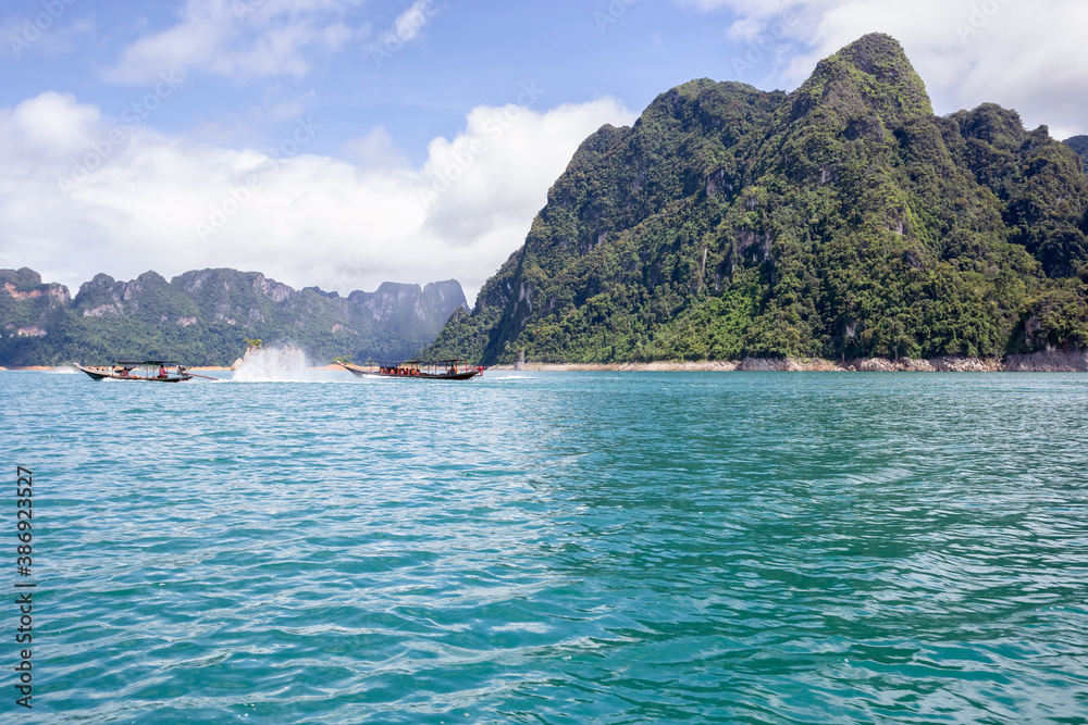 Obraz premium Beautiful mountains lake river sky and natural attractions in Ratchaprapha Dam at Khao Sok National Park, Surat Thani Province, Thailand.