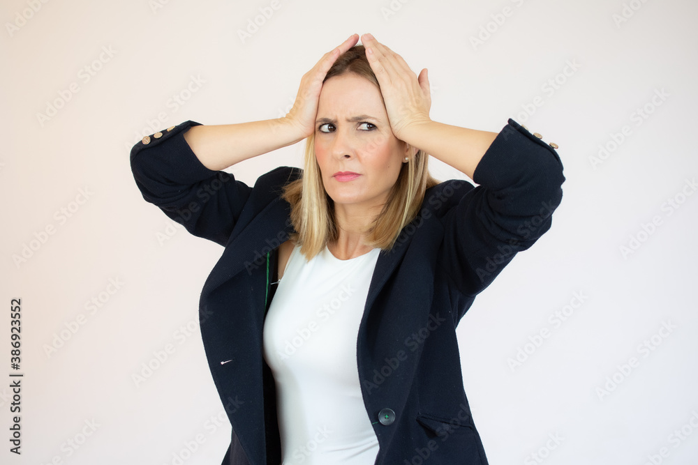 Young businesswoman over isolated white background doing nervous gesture Young businesswoman over isolated white background doing nervous gesture