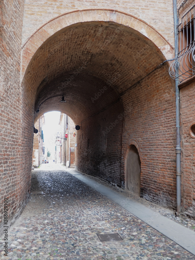 Fototapeta premium Ferrara, Italy. Downtown, ancient archway.