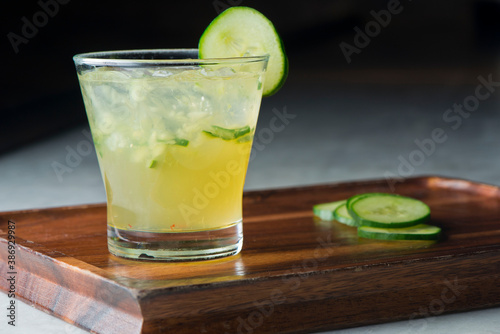 Margarita. Classic traditional Mexican cocktail. Made with Blanco tequila, fresh lime juice, agave syrup and orange juice. Served in salt rimmed tumbler over ice and garnished with a lime.