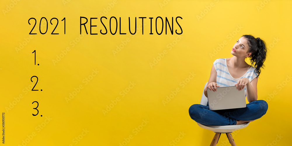 2021 Resolutions with young woman using a laptop computer - obrazy, fototapety, plakaty 
