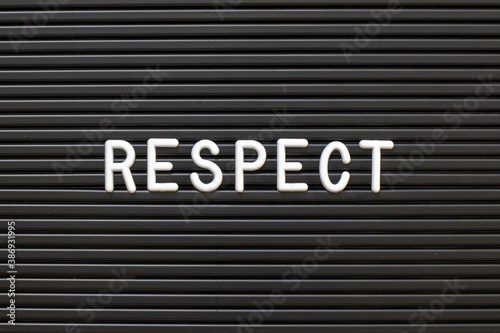Black color felt letter board with white alphabet in word respect background