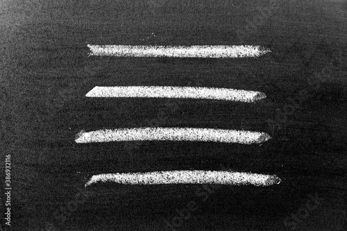 White color chalk hand drawing in set of line or square shape on black board background