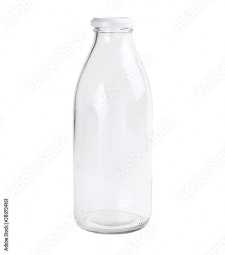 Empty glass bottle isolated on a white background. Clear bottle. Front view