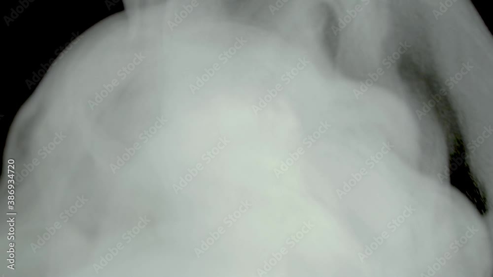 Abstract white steam smoke on a black background.A cloud of chemical smoke.Glossy rolling poisonous gas cloud of reagent in chemistry.Toxins and toxic substances in motion.Boiling is the bubbling of a