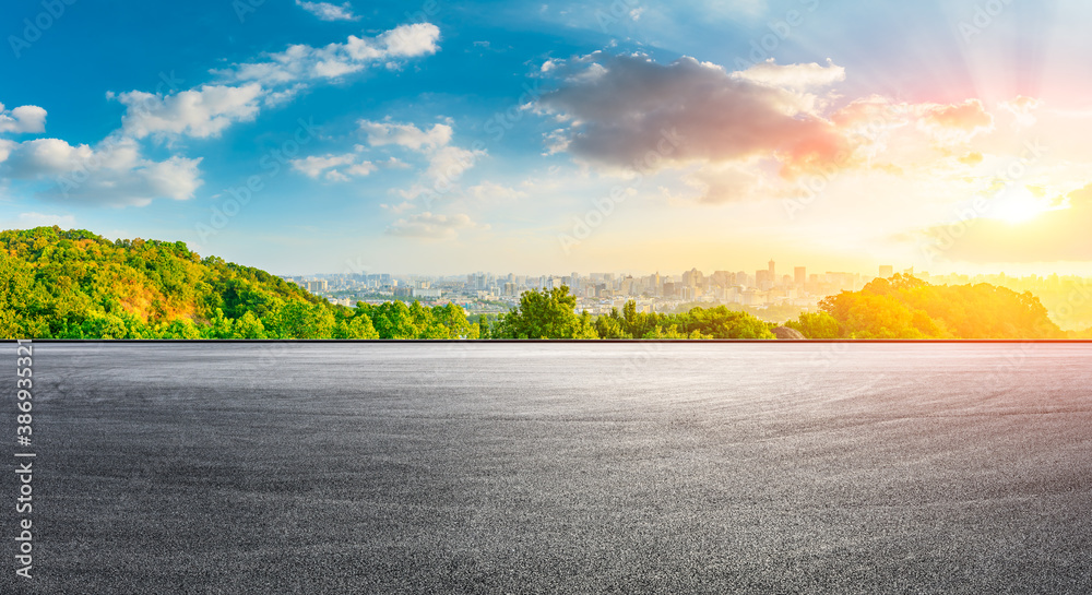 Fototapeta premium Race track road and city skyline with buildings in Hangzhou at sunrise.