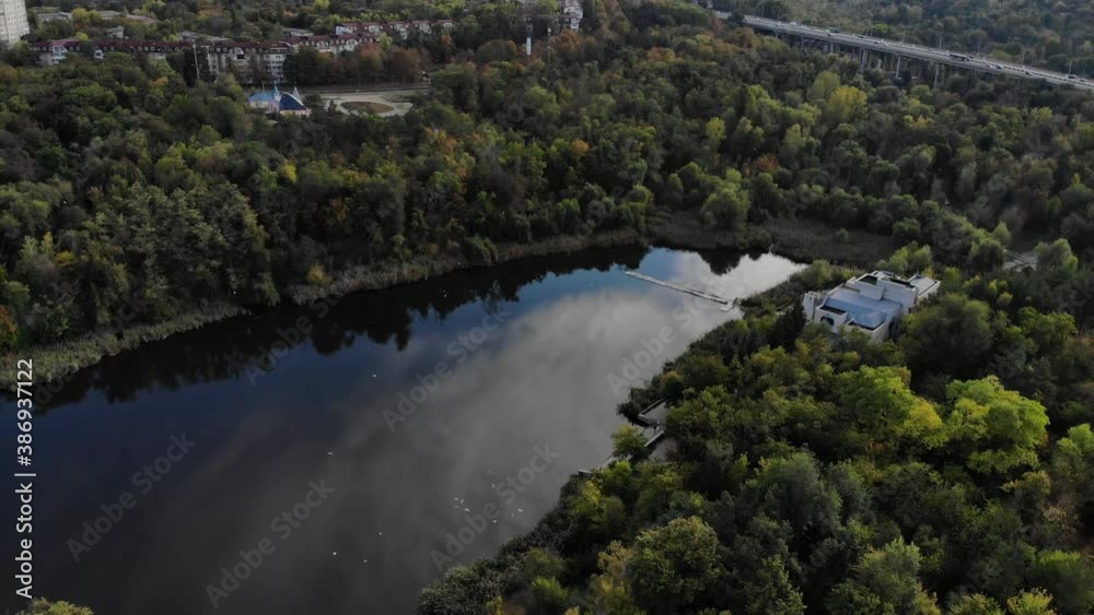 Aerial view with drone over a city, House located in the middle of the park. Beautifully protected lake. Flying birds. The city of Chisinau seen from above. Beautiful landscape Aerial view with drone over a city, House located in the middle of the park. Beautifully protected lake. Flying birds. The city of Chisinau seen from above. Beautiful landscape
