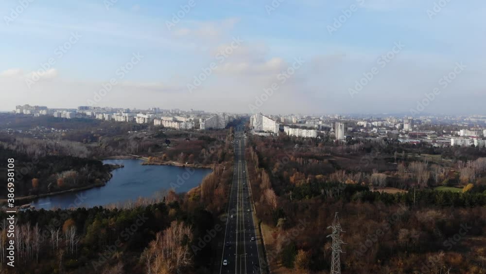 Aerial view with drone over a city, House located in the middle of the park. Beautifully protected lake. Flying birds. The city of Chisinau seen from above. Beautiful landscape Aerial view with drone over a city, House located in the middle of the park. Beautifully protected lake. Flying birds. The city of Chisinau seen from above. Beautiful landscape