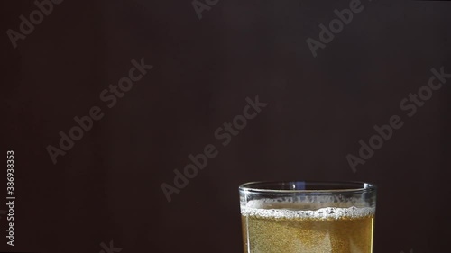 Wallpaper Mural Macro Shot Of Pouring Light Beer Into Glass. Foam of beer Torontodigital.ca