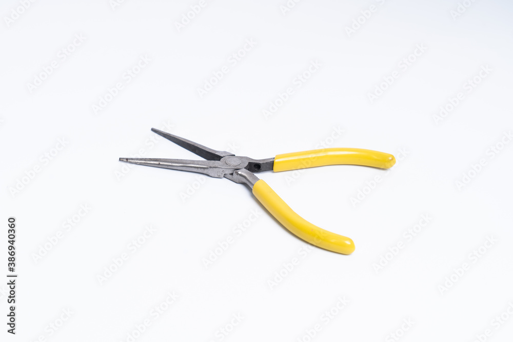 Yellow Mini Needle nose toothed pliers isolated on white background clipping path Yellow Mini Needle nose toothed pliers isolated on white background clipping path