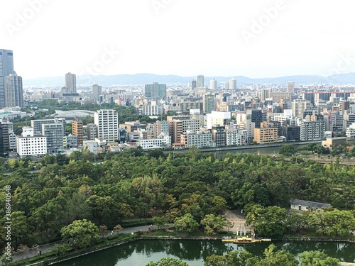Osaka downtown cityscape with park and river