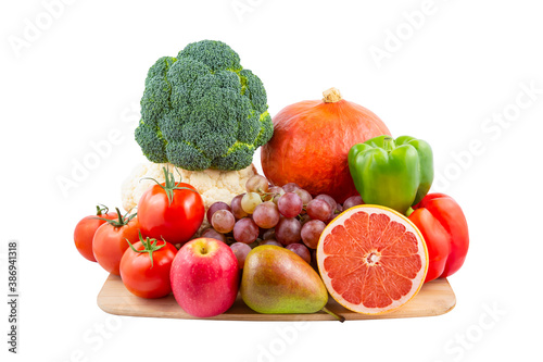 Group vegetables and Fruits Apples, grapes, oranges, and bananas in the wooden basket with carrots, tomatoes, guava, chili, eggplant, and salad on the white background