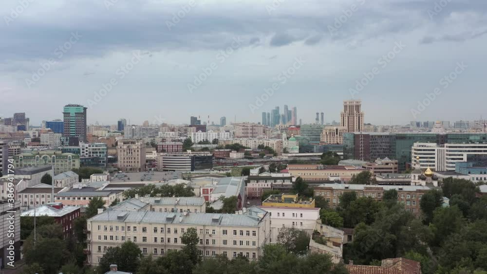 Buildings in the centre of Moscow landscape, fly over drone shot. Many diverse factory and residential buildings top view shot in Moscow during a grey autumn day Buildings in the centre of Moscow landscape, fly over drone shot. Many diverse factory and residential buildings top view shot in Moscow during a grey autumn day
