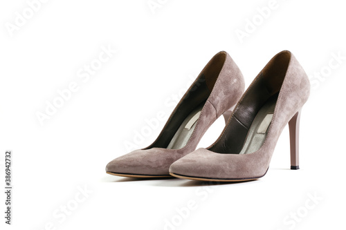 Stylish pink powder shoes on an isolated white background