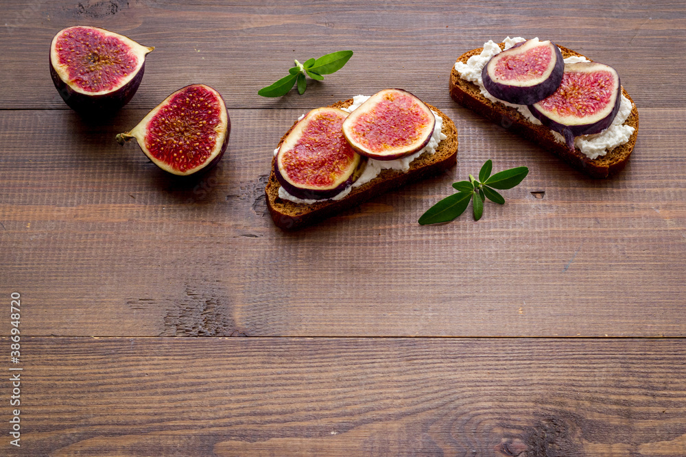 Canape or sandwich with figs and cheese, overhead view Canape or sandwich with figs and cheese, overhead view