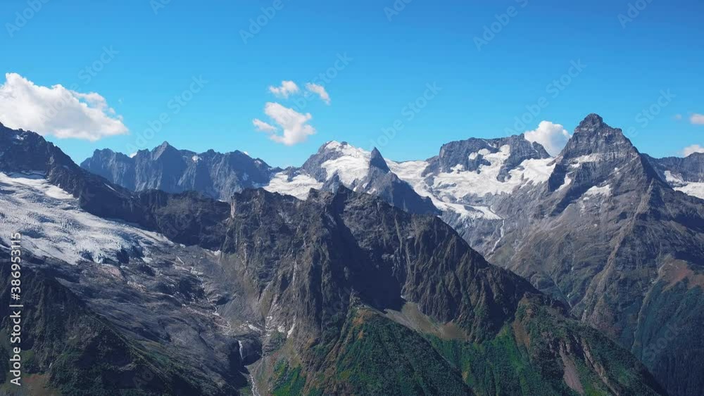 High mountains forest and sky with clouds High mountains forest and sky with clouds