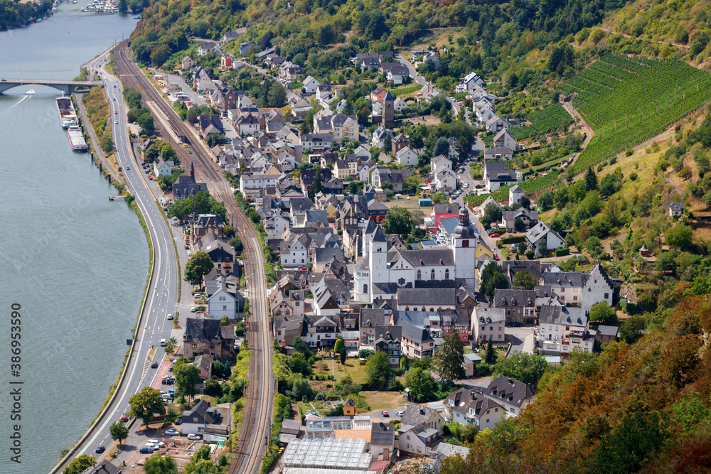 Aerial view of the Treis-Karden municipality, the river Moselle and the surrounding hills on a sunny day. Cochem-Zell, Rhineland-Palatinate, Germany.