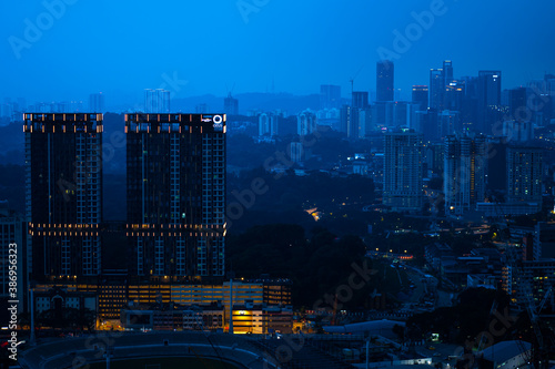 Canvas Print Evening city sunset with rain clouds