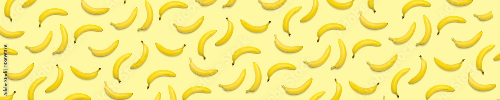 Bananas creative background. pop art bananas background. Tropical abstract background with banana. Colorful fruit yellow banana