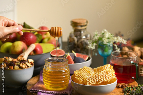 Obraz na płótnie Honey, Honeycomb, Tea, Dried Fruits on Autumn Table w salonie