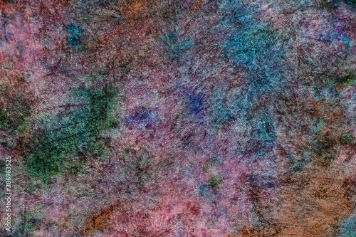 textile background - pink velvet hand-coloured in tie-dye abstract batik technique