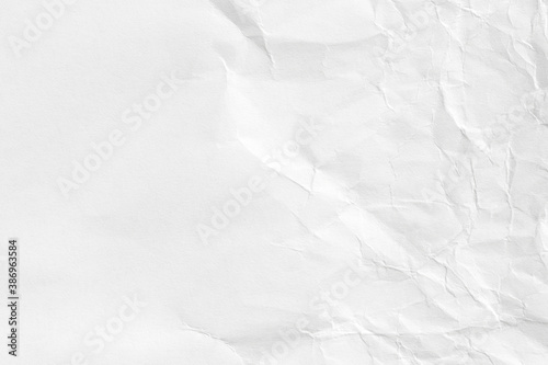 White crumpled paper background, texture old for web design screensavers. Template for various purposes or creating packaging.