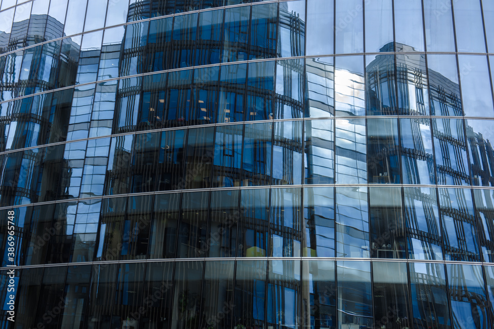 Mirror high blue Skyscraper. Modern high-rise building made of glass. Mirror high blue Skyscraper. Modern high-rise building made of glass.