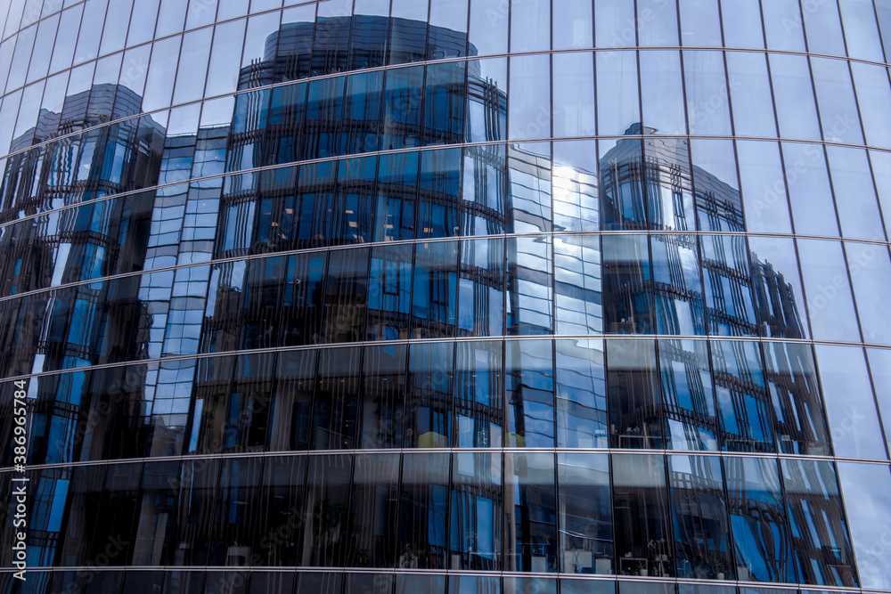 Mirror high blue Skyscraper. Modern high-rise building made of glass. Mirror high blue Skyscraper. Modern high-rise building made of glass.