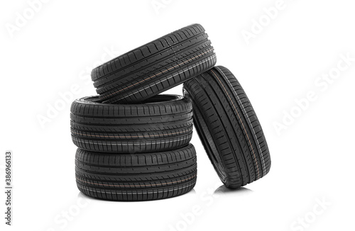 Car tires on a white background. Four wheels.
