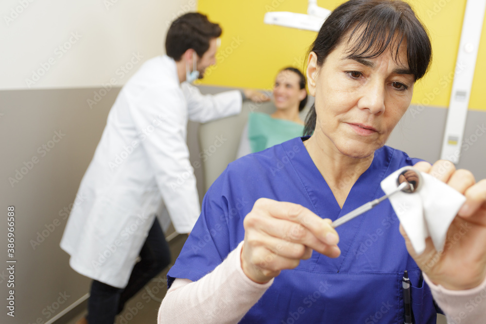 Obraz premium woman taking care or mirror in the dental office