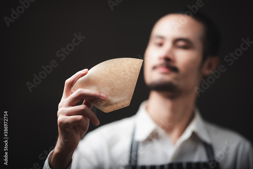 barista showing coffee filt...