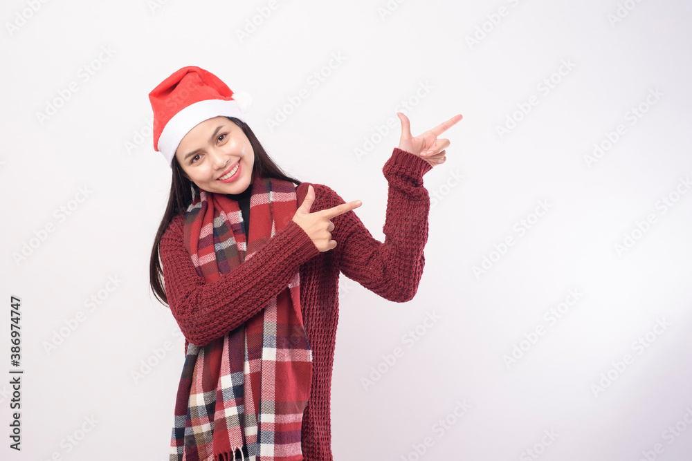 Portrait of young smiling woman wearing red Santa Claus hat isolated white background studio. Portrait of young smiling woman wearing red Santa Claus hat isolated white background studio.
