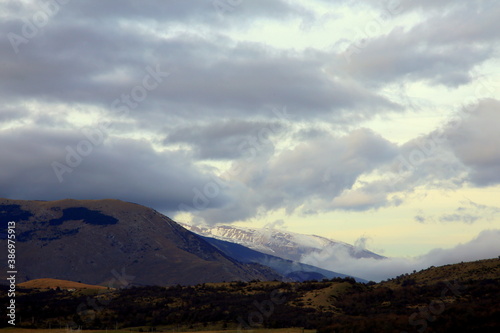 Cloudy sky on snow-covered peaks, Apennines mountains, Abruzzo, Italy 