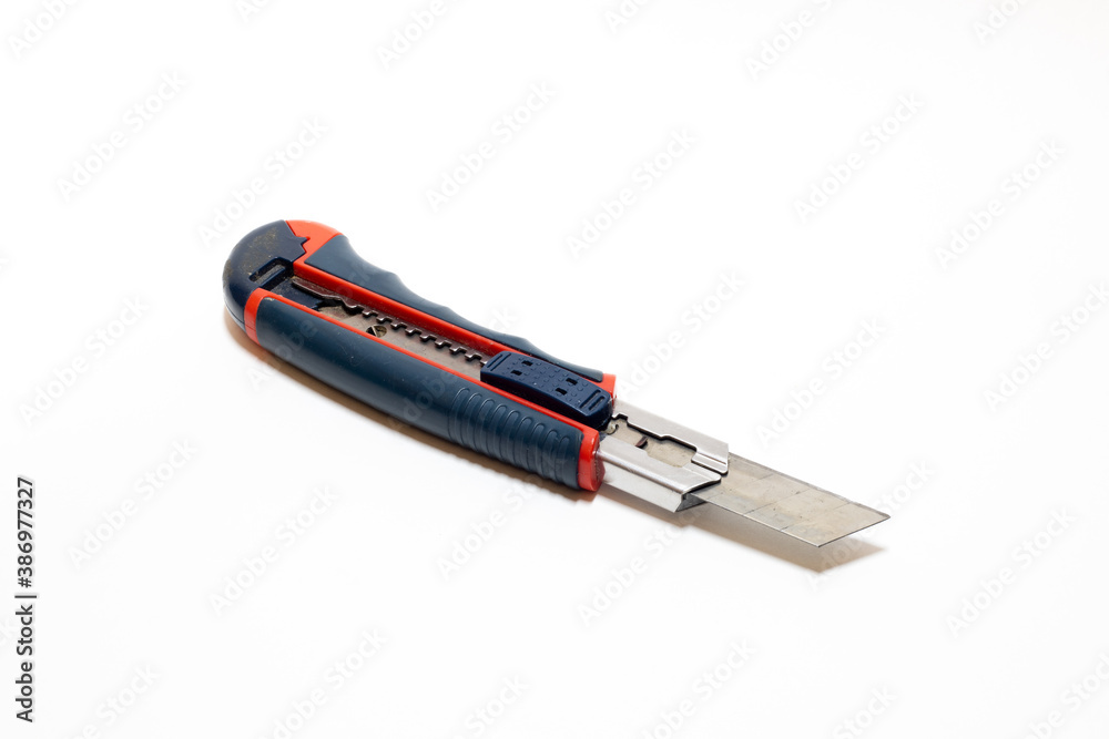 Cutter knife isolated on white background. Stationery paper knife. Office knife. Cutter knife isolated on white background. Stationery paper knife. Office knife.