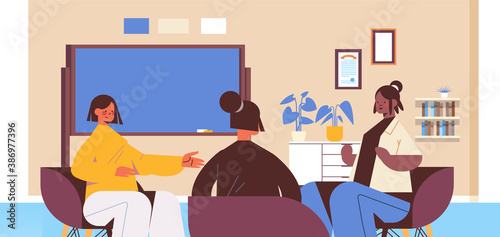 group of mix race female friends discussing during meeting in women's club girls supporting each other union of feminists concept office interior horizontal portrait vector illustration