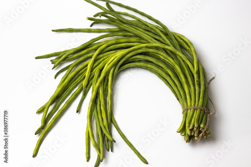 Bunch of fresh long bean isolated on white background photo